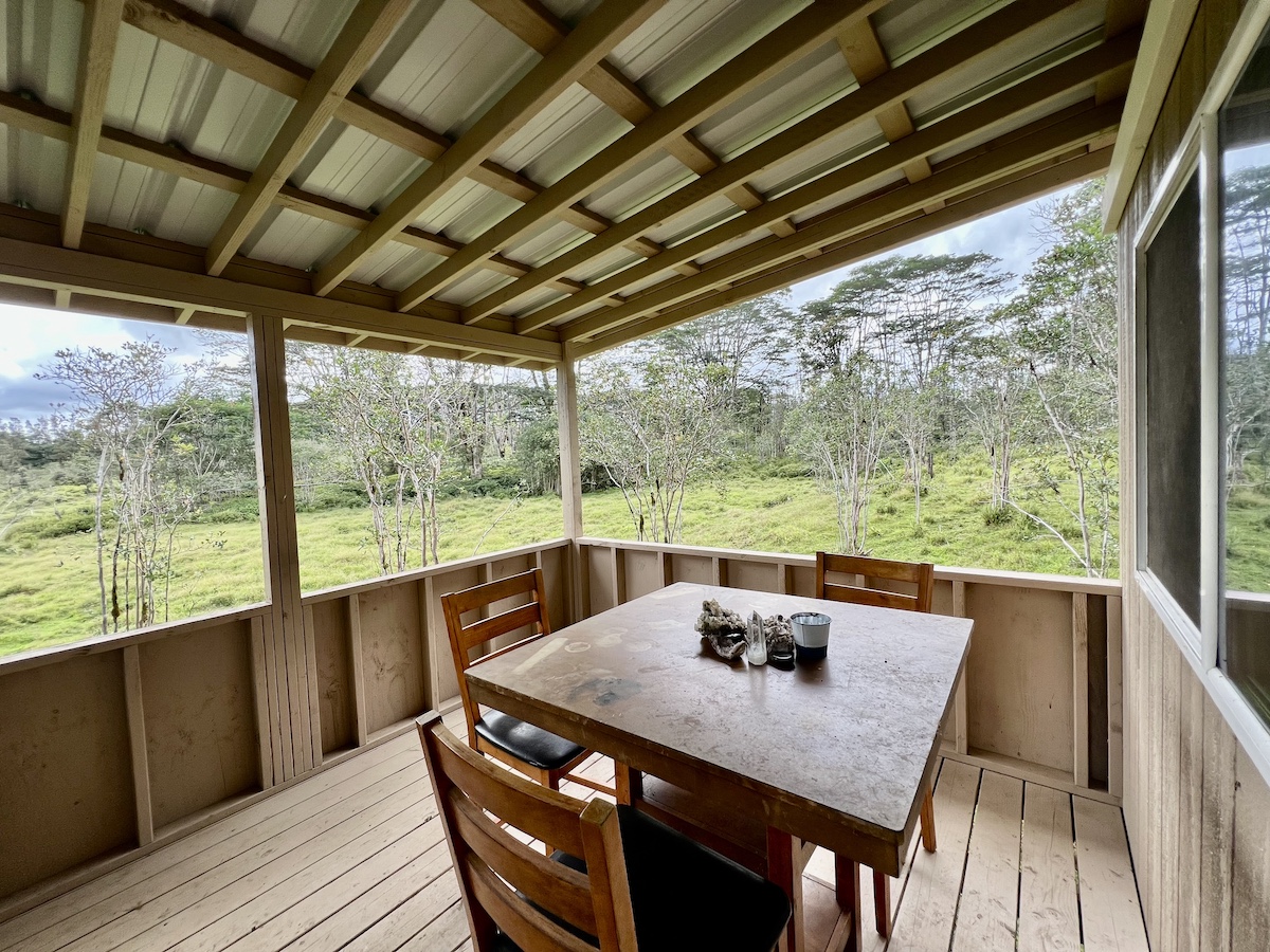 17-3853 Enos Road Mountain View, HI 96760 - Photo 3 of 20 a view of a dining room with furniture window and outside view