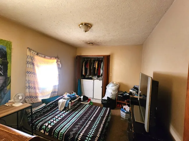 a bed room with a window