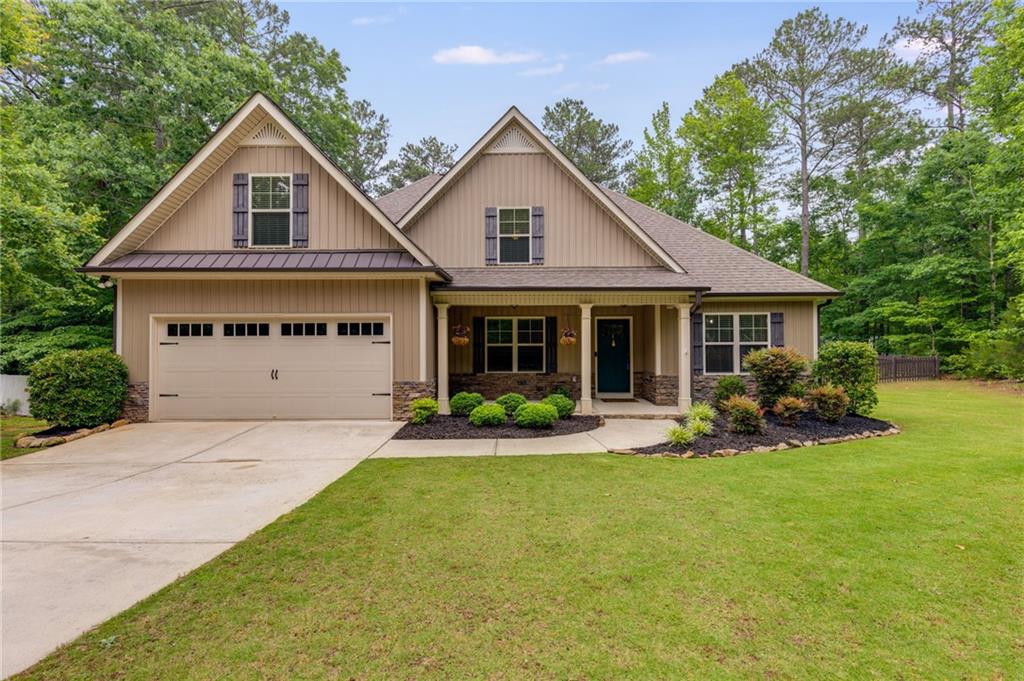 a front view of a house with a yard and porch