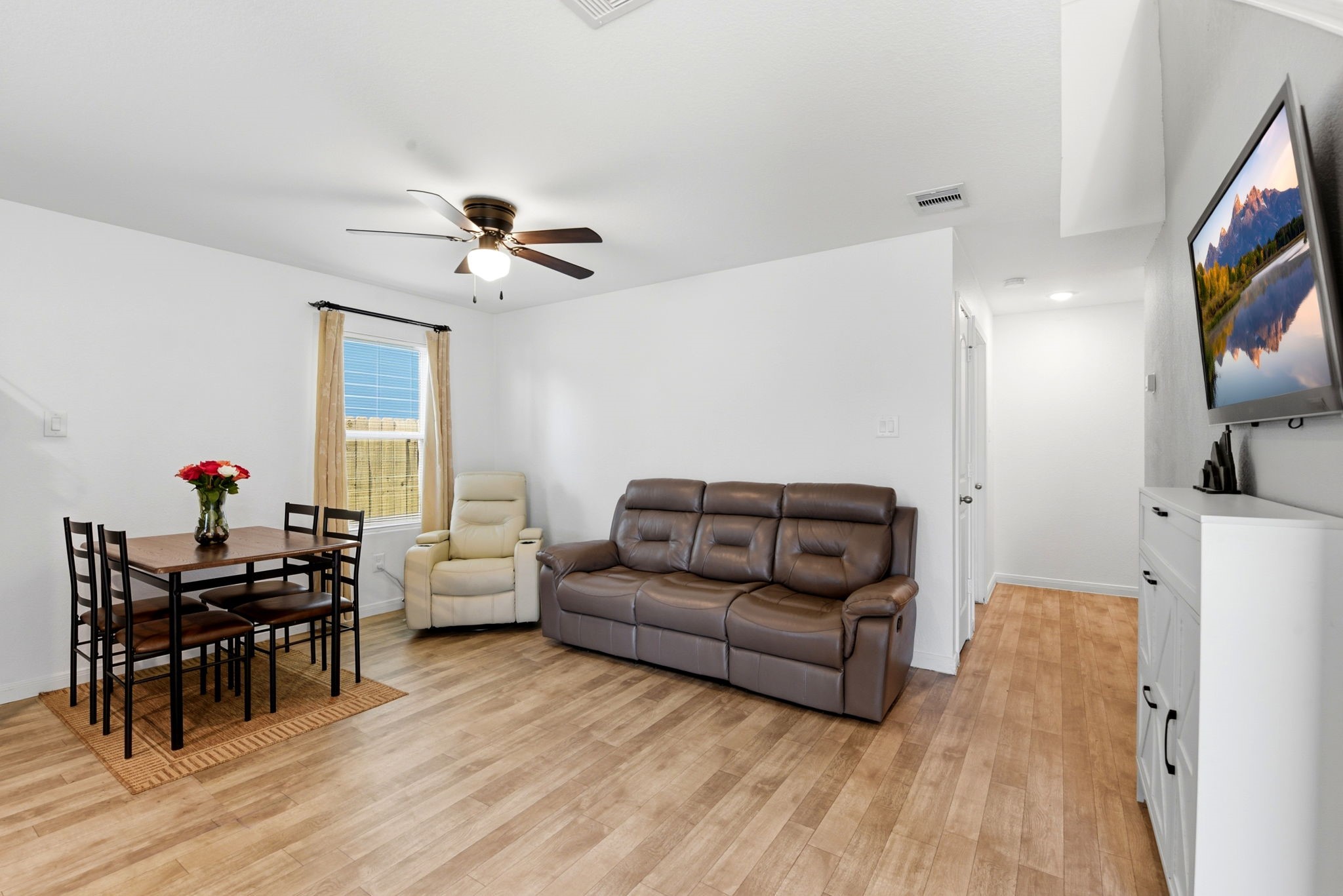 9819 Emerald Stone Way Conroe, TX 77306 - Photo 15 of 38 a living room with furniture and a flat screen tv