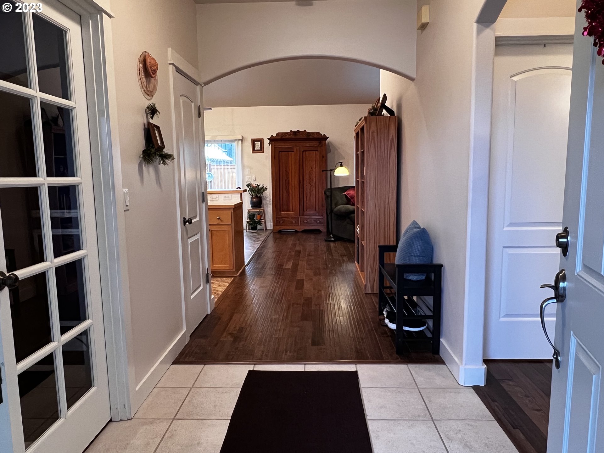 947 67th Place Springfield, OR 97478 - Photo 4 of 32 a view of a hallway with wooden floor and furniture