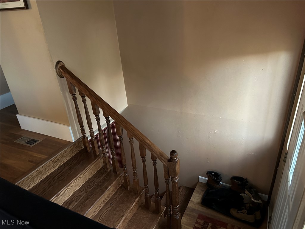 61634 Institute Road Lore City, OH 43755 - Photo 7 of 20 Staircase featuring wood finished floors