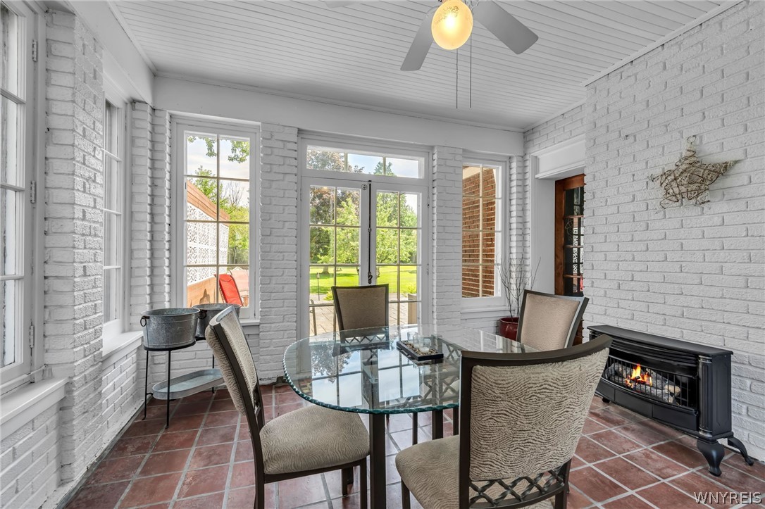 357 Lebrun Road Amherst, NY 14226 - Photo 20 of 50 Sunroom w/ gas fireplace and direct access to 88'
