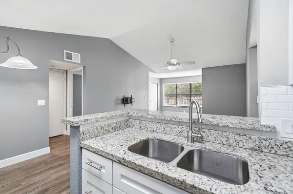 a kitchen with a sink and a window