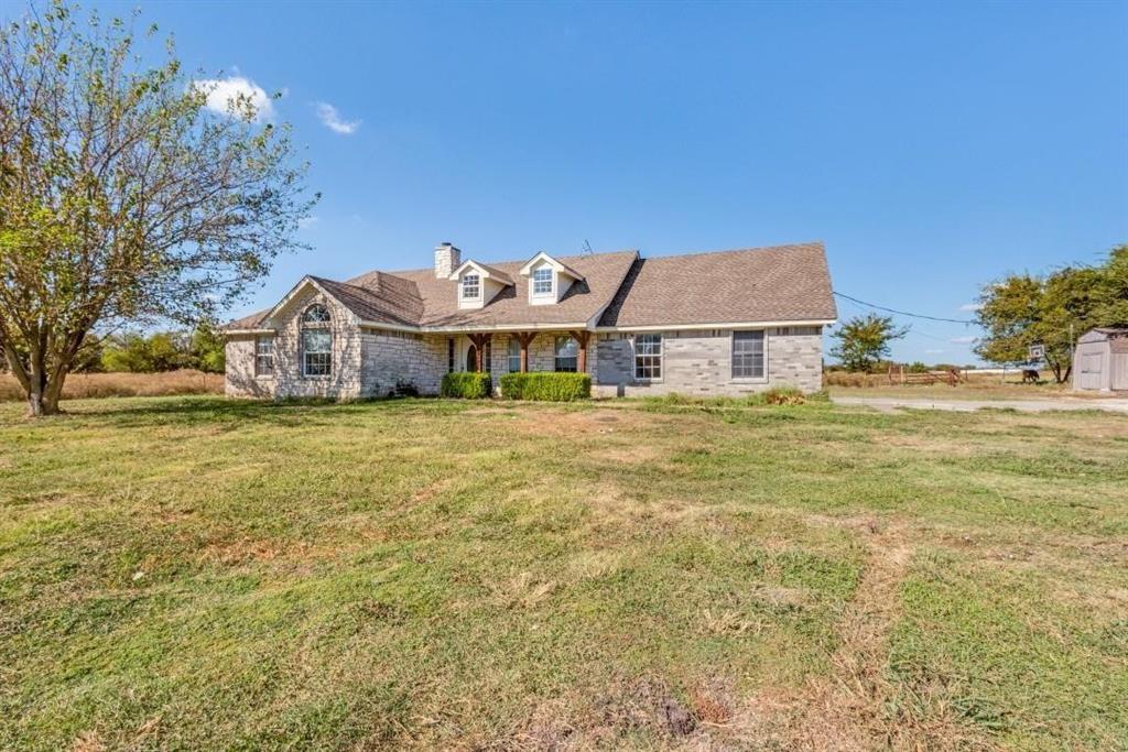 2072 Marshall Road Waxahachie, TX 75167 - Photo 3 of 14 a blue swimming pool is sitting in front of a big yard