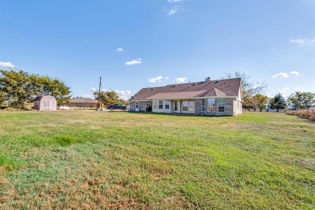 2072 Marshall Road Waxahachie, TX 75167 - Photo 4 of 14 a front view of house with yard and trees in the background