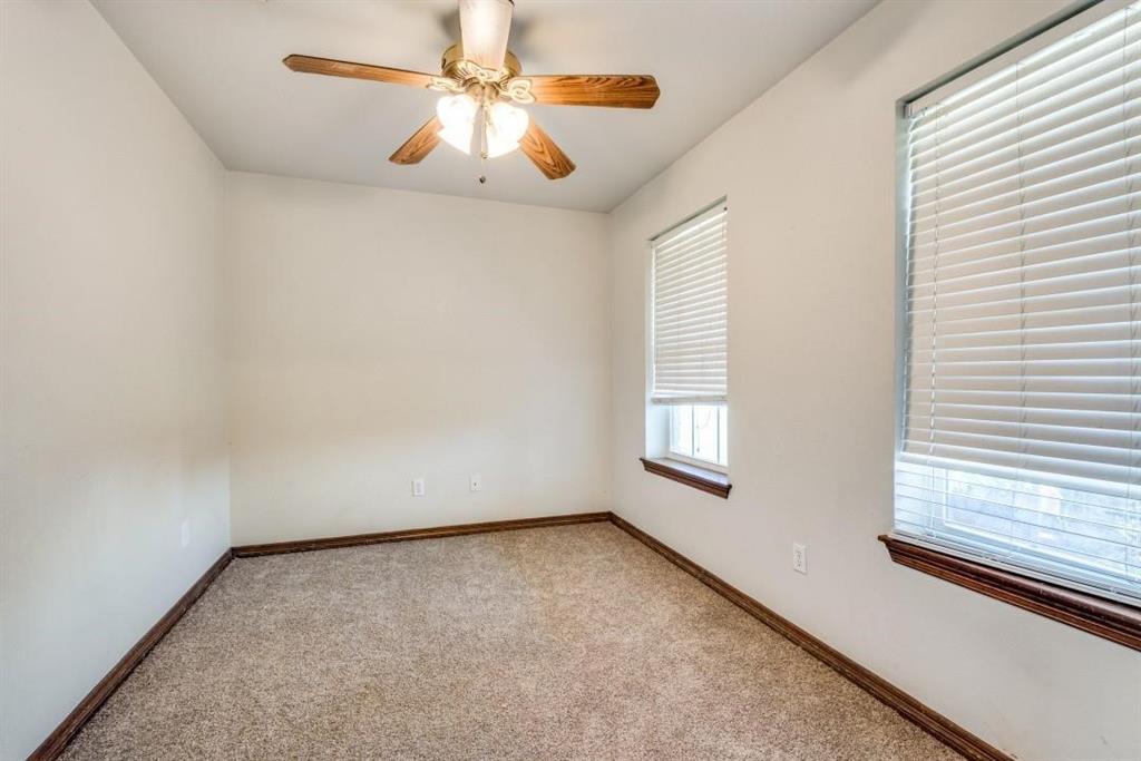 2072 Marshall Road Waxahachie, TX 75167 - Photo 5 of 14 an empty room with windows and fan