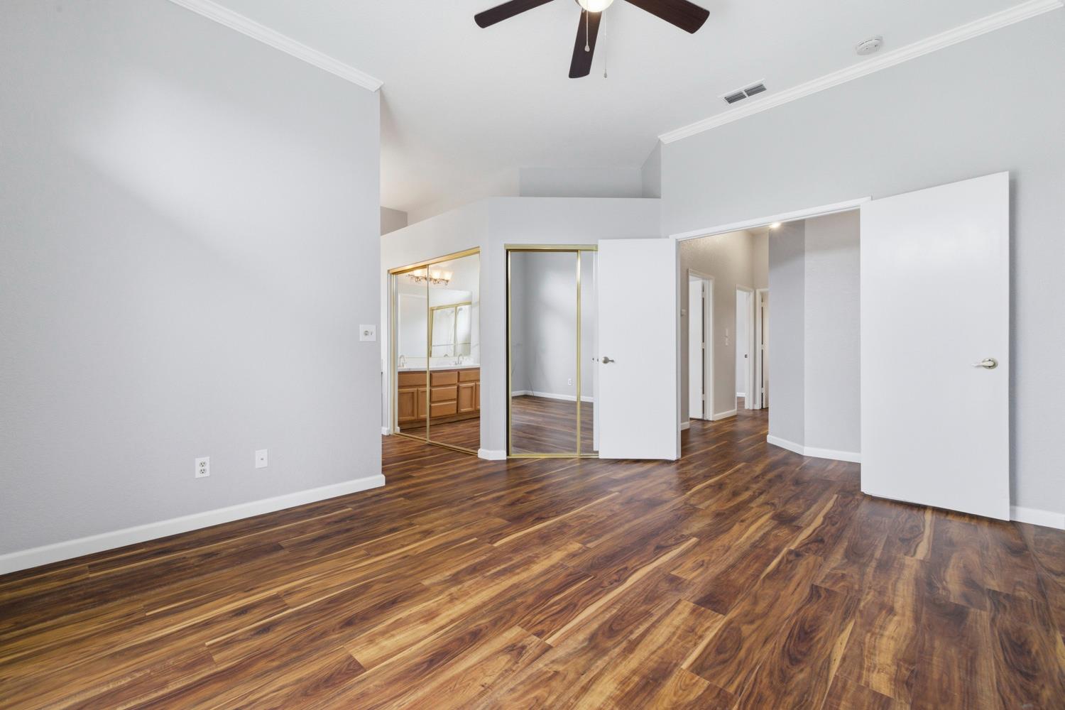 969 Colson Way Galt, CA 95632 - Photo 21 of 38 wooden floor in an empty room with a window