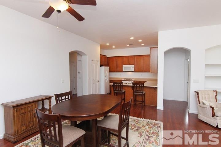 450 Manciano Way Reno, NV 89521 - Photo 13 of 39 a view of a dining room with furniture and wooden floor