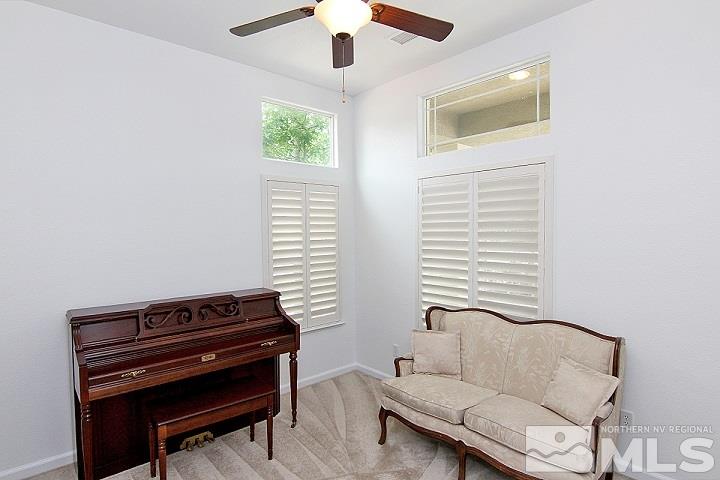 450 Manciano Way Reno, NV 89521 - Photo 15 of 39 a living room with furniture and a piano