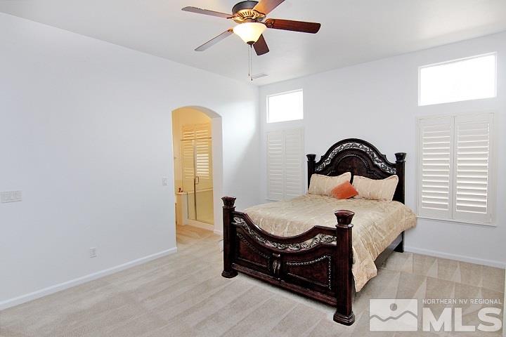 450 Manciano Way Reno, NV 89521 - Photo 20 of 39 a bedroom with a bed and a window
