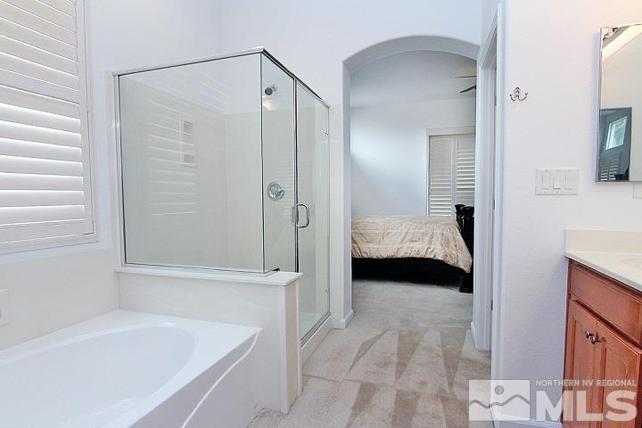 450 Manciano Way Reno, NV 89521 - Photo 22 of 39 a en suite spacious bathroom with a tub shower and bedroom