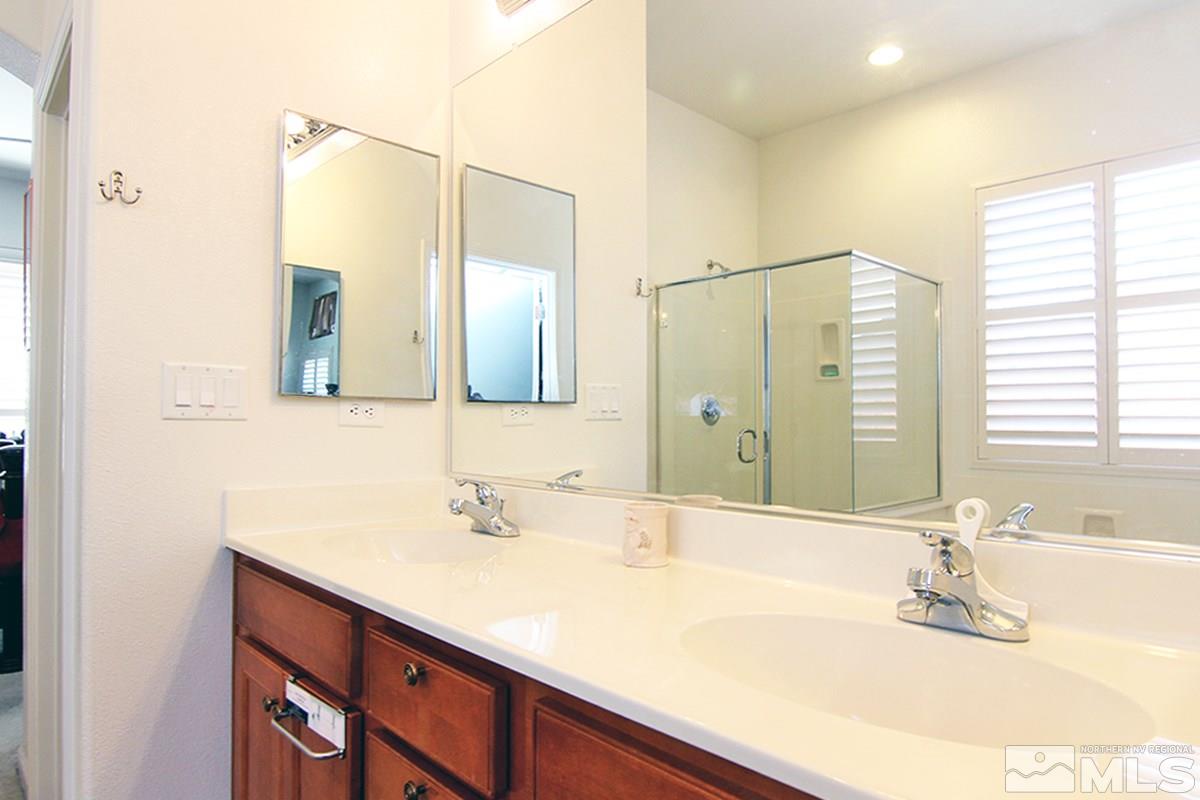450 Manciano Way Reno, NV 89521 - Photo 23 of 39 a bathroom with a sink and a mirror
