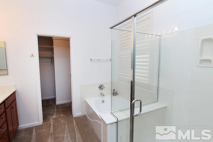 450 Manciano Way Reno, NV 89521 - Photo 24 of 39 a bathroom with a shower and a sink