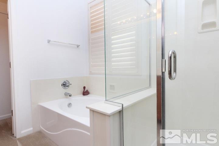 450 Manciano Way Reno, NV 89521 - Photo 27 of 39 a bathroom with a sink and a mirror