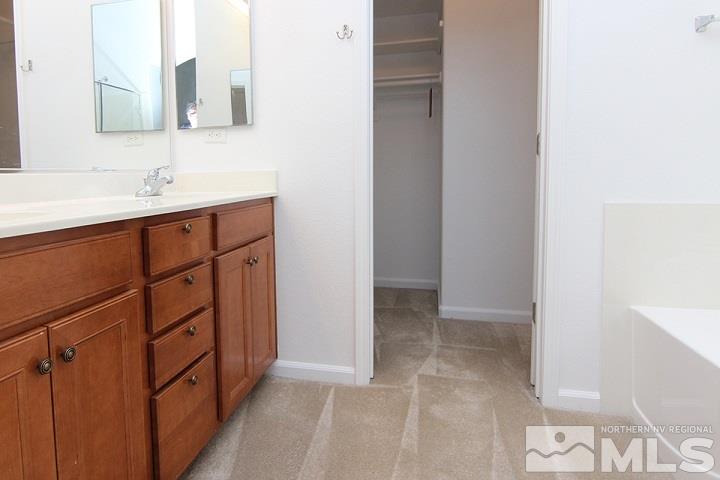450 Manciano Way Reno, NV 89521 - Photo 28 of 39 a bathroom with a sink and a mirror
