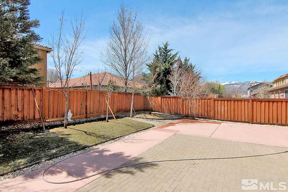 450 Manciano Way Reno, NV 89521 - Photo 33 of 39 a backyard of a house with lots of green space