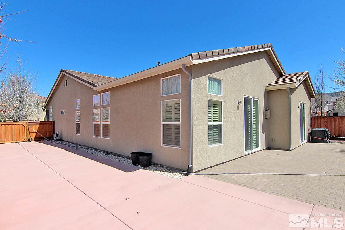 450 Manciano Way Reno, NV 89521 - Photo 36 of 39 a front view of a house with a yard