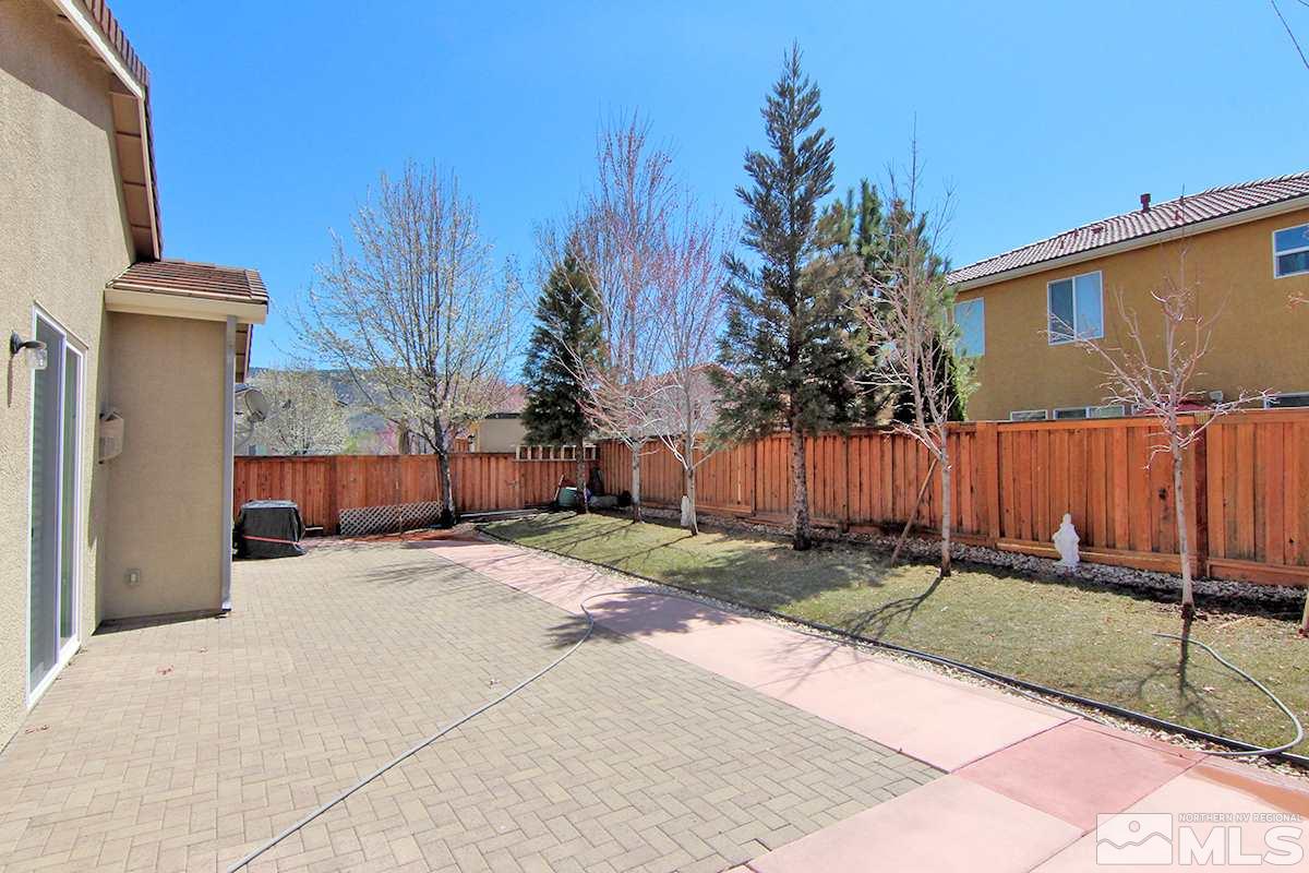 450 Manciano Way Reno, NV 89521 - Photo 37 of 39 a backyard of a house with a garden