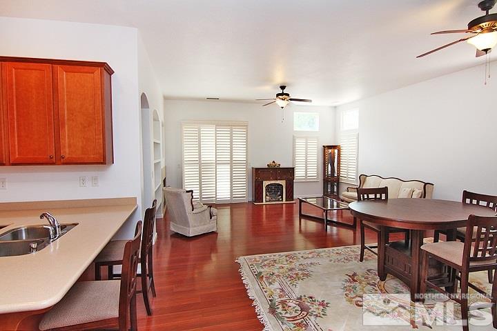 450 Manciano Way Reno, NV 89521 - Photo 4 of 39 a view of a a dining room with furniture window and wooden floor