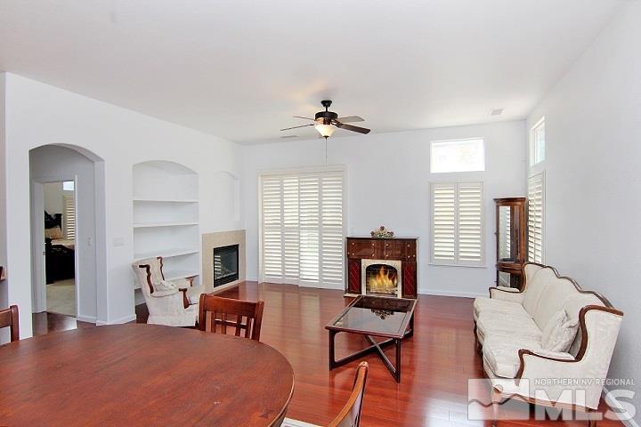 450 Manciano Way Reno, NV 89521 - Photo 6 of 39 a bedroom with furniture window and wooden floor