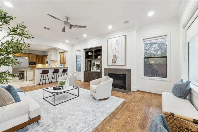 a living room with furniture and fireplace