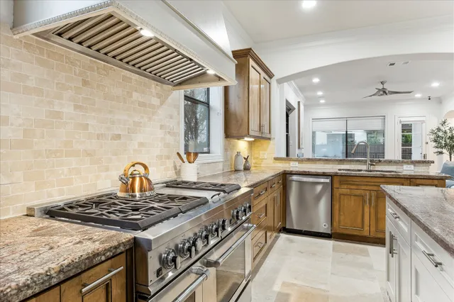 a kitchen with a stove and a sink