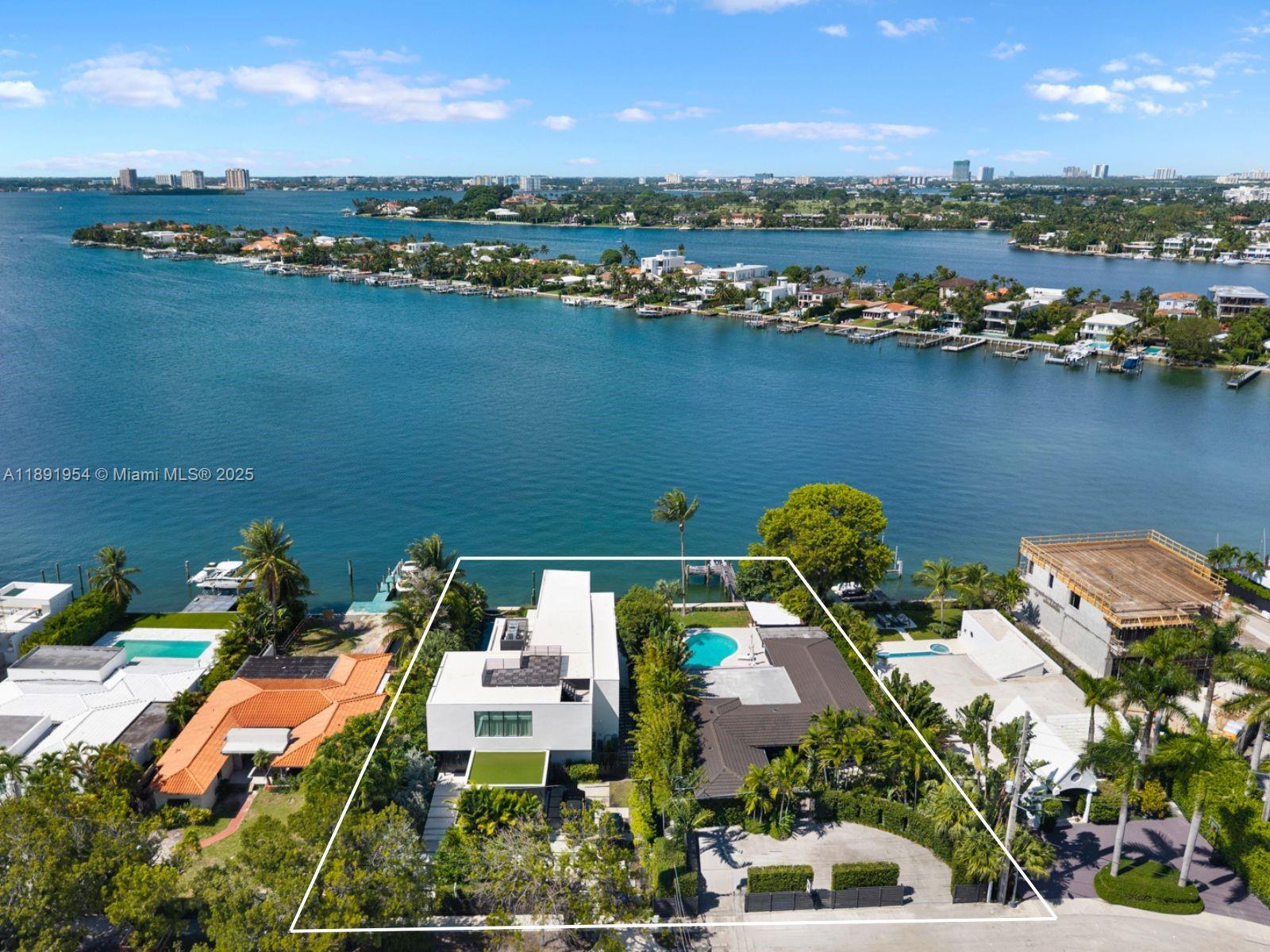 1155-1165 North Biscayne Point Road Miami Beach, FL 33141 - Photo 2 of 35 an aerial view of a houses with a lake view