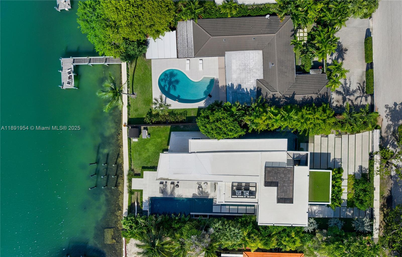 1155-1165 North Biscayne Point Road Miami Beach, FL 33141 - Photo 33 of 35 an aerial view of a house with garden space and street view