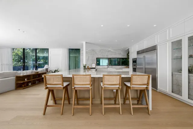 a dining room with furniture window and wooden floor