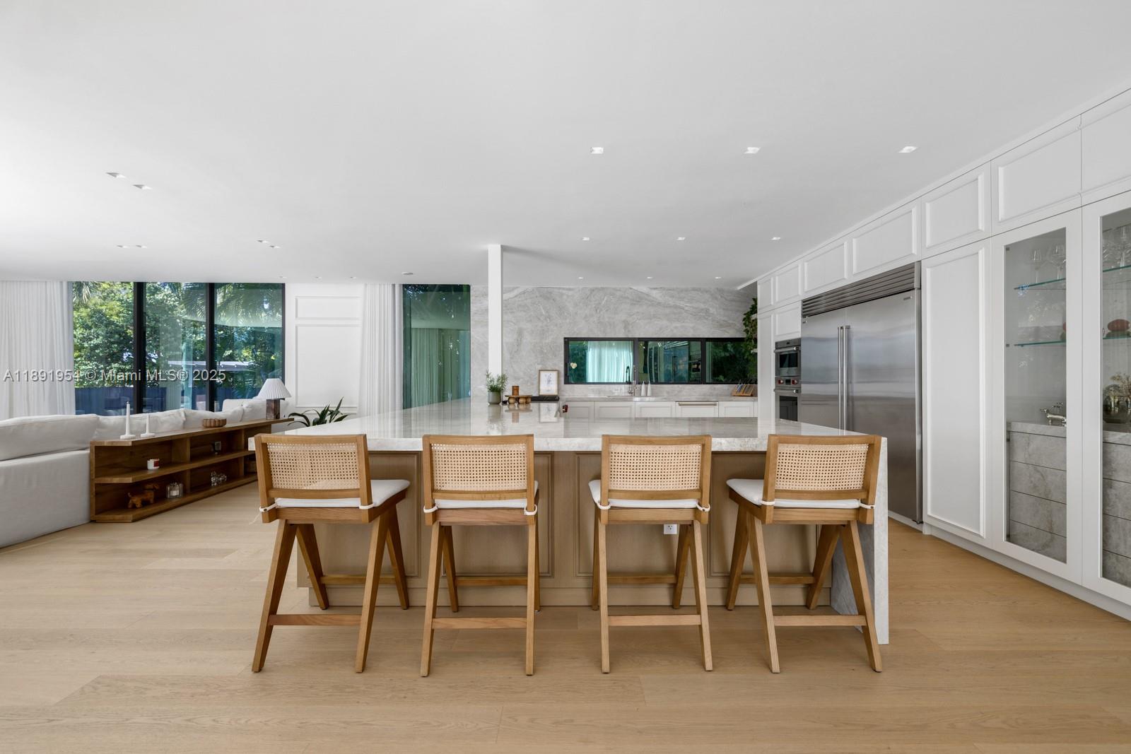 1155-1165 North Biscayne Point Road Miami Beach, FL 33141 - Photo 10 of 35 a dining room with furniture window and wooden floor