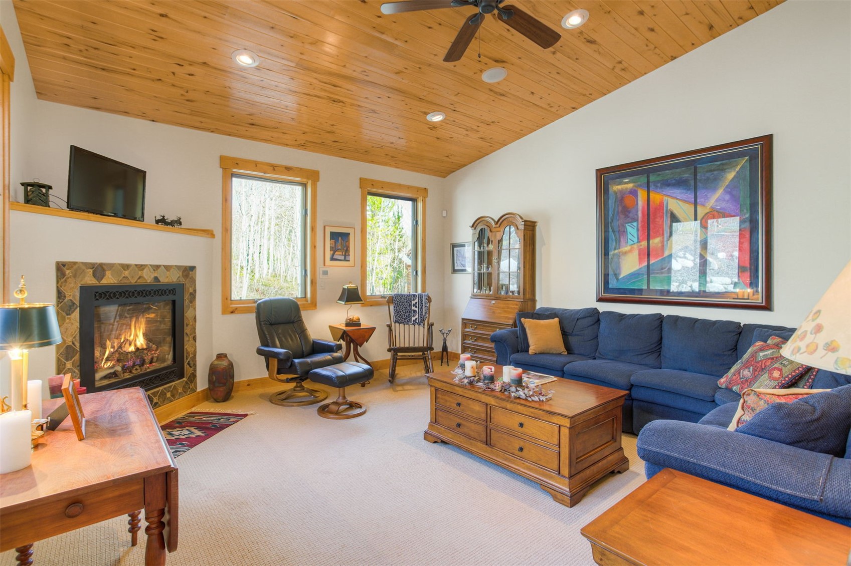 727 Willowbrook Road Silverthorne, CO 80498 - Photo 21 of 47 a living room with furniture gym equipment and a fireplace