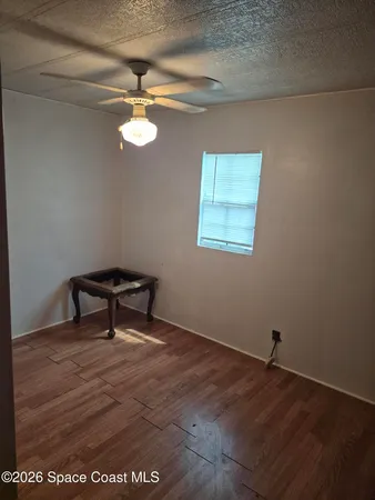a bedroom with bed and window