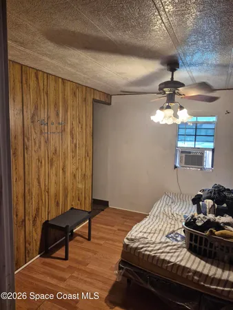 a kitchen with a sink a stove top oven and cabinetry