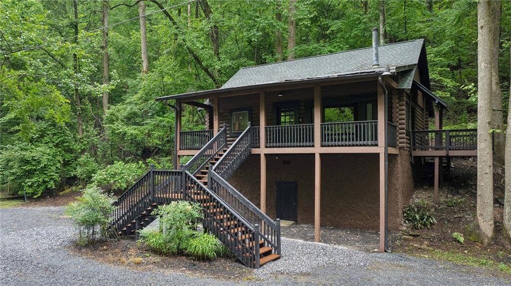 853 Bates Road Ellijay, GA 30540 - Photo 1 of 1 a backyard of a house with lots of green space