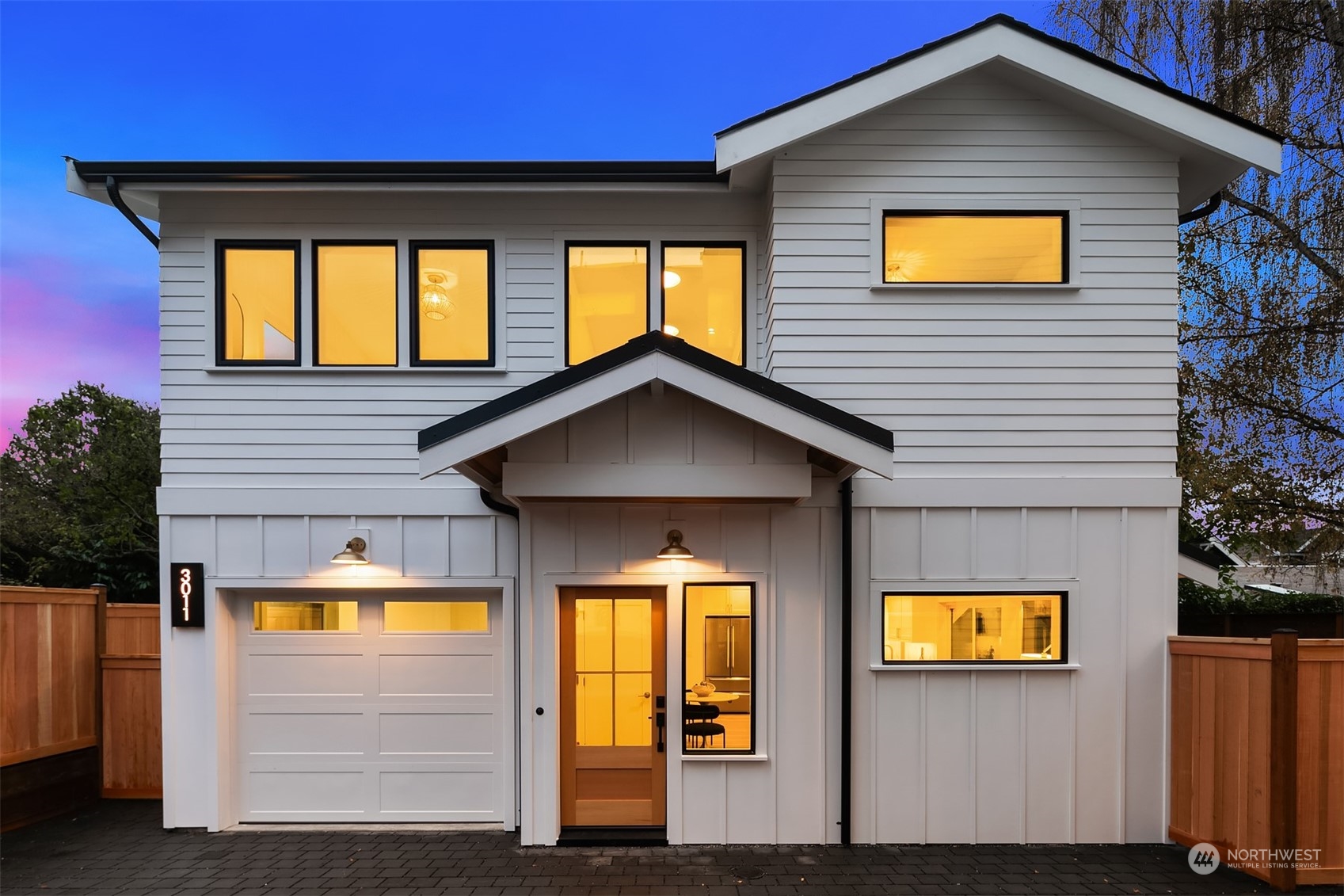 3011 Northwest 66th Street Seattle, WA 98117 - Photo 1 of 15 a view of a house with a swimming pool and wooden fence