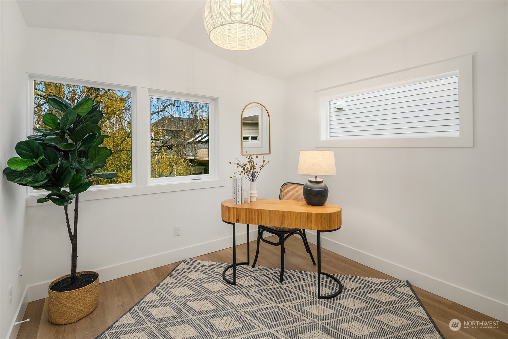 3011 Northwest 66th Street Seattle, WA 98117 - Photo 11 of 15 a workspace with furniture and a potted plant