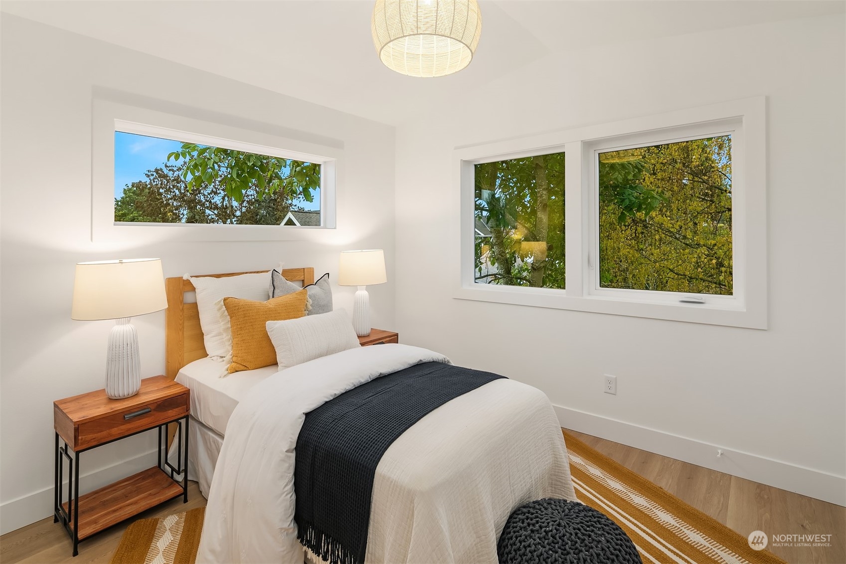 3011 Northwest 66th Street Seattle, WA 98117 - Photo 12 of 15 a bedroom with a bed and a window