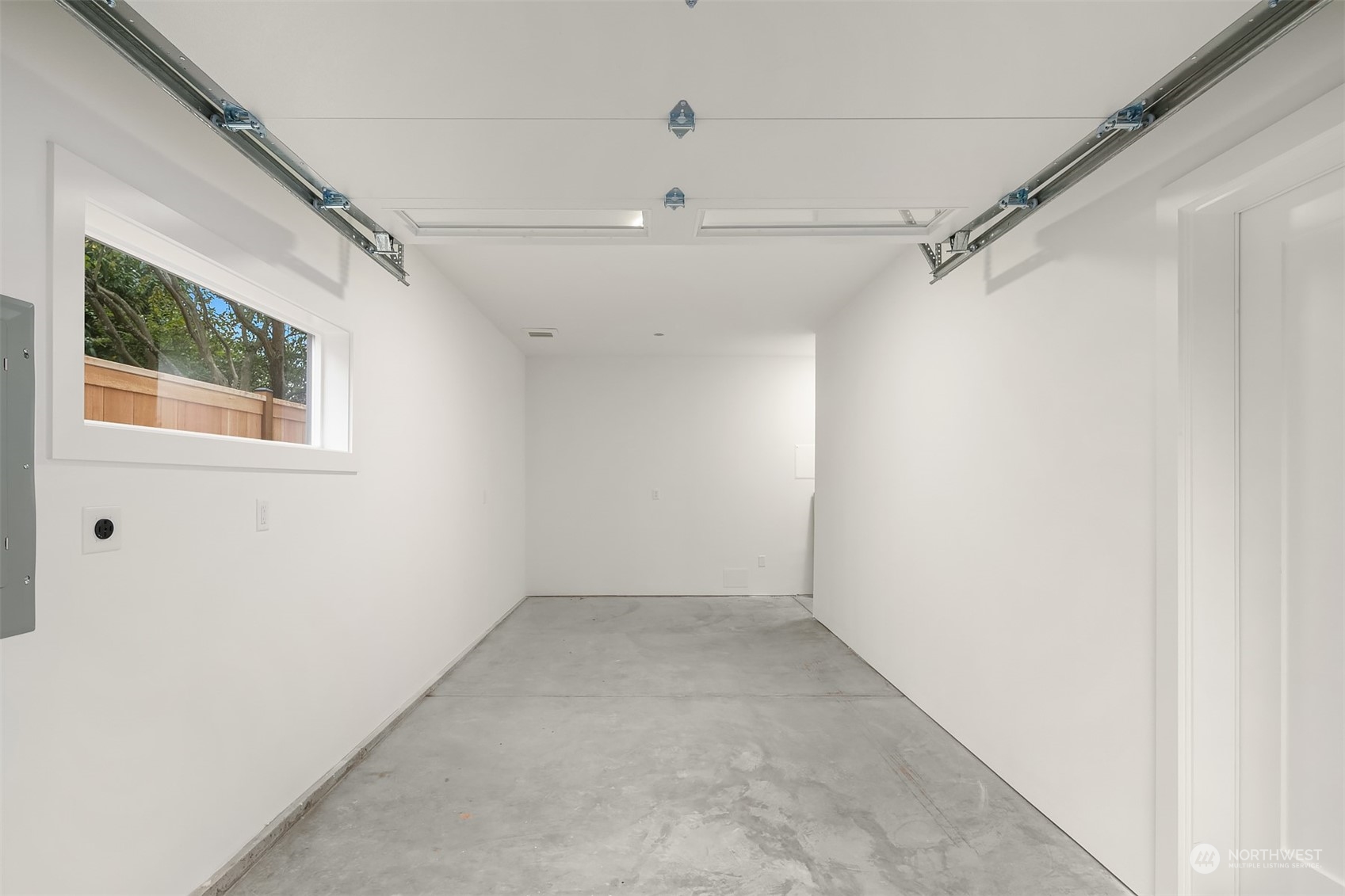 3011 Northwest 66th Street Seattle, WA 98117 - Photo 14 of 15 a view of a small space with wooden floor and a window