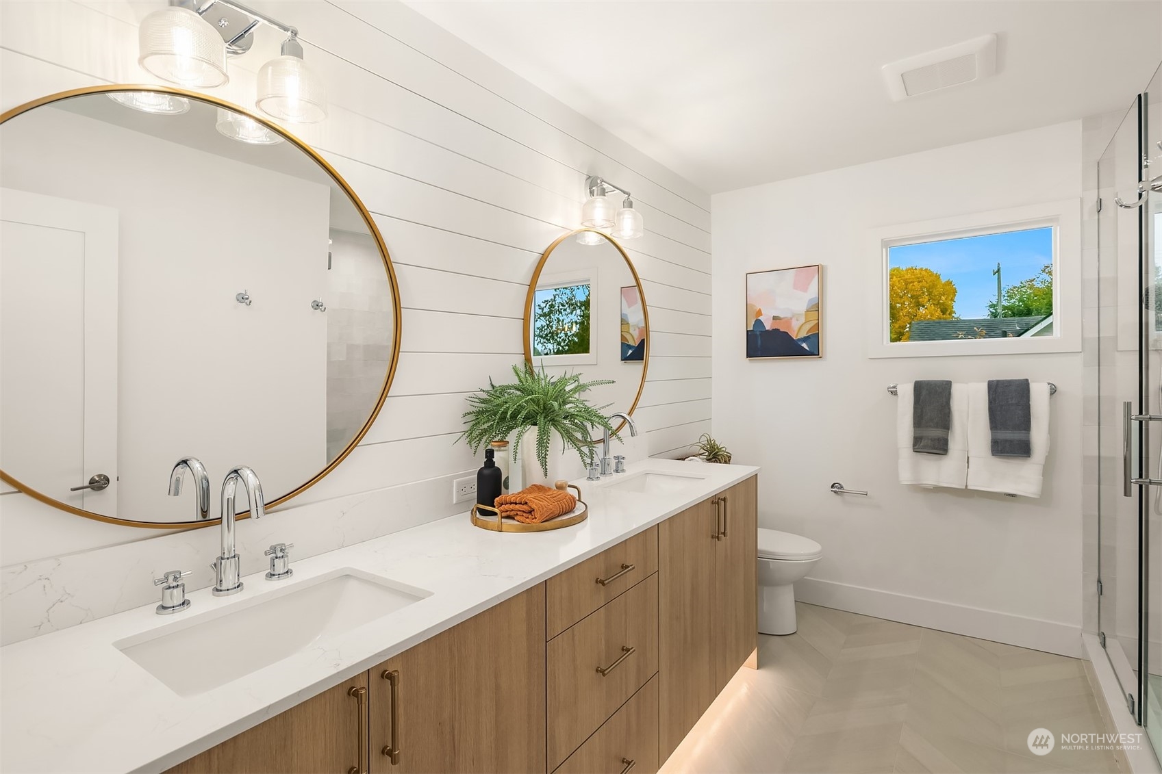 3011 Northwest 66th Street Seattle, WA 98117 - Photo 10 of 15 a bathroom with a toilet sink and mirror