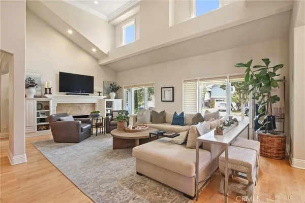 a living room with fireplace furniture and a flat screen tv