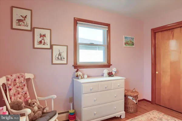 a bathroom with a sink mirror vanity and toilet