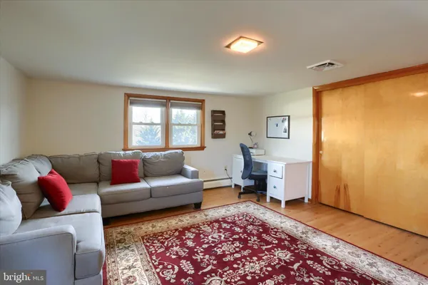 a living room with furniture and a window