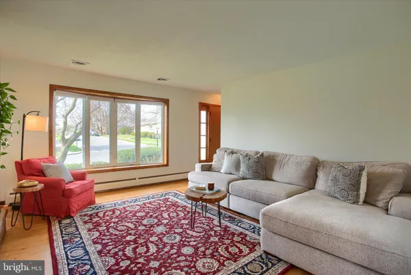 a living room with furniture and a rug