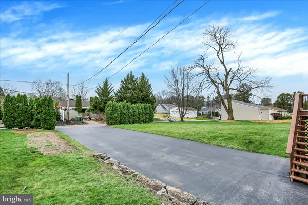 a backyard of a house with lots of green space