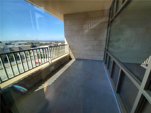 a view of balcony with wooden floor