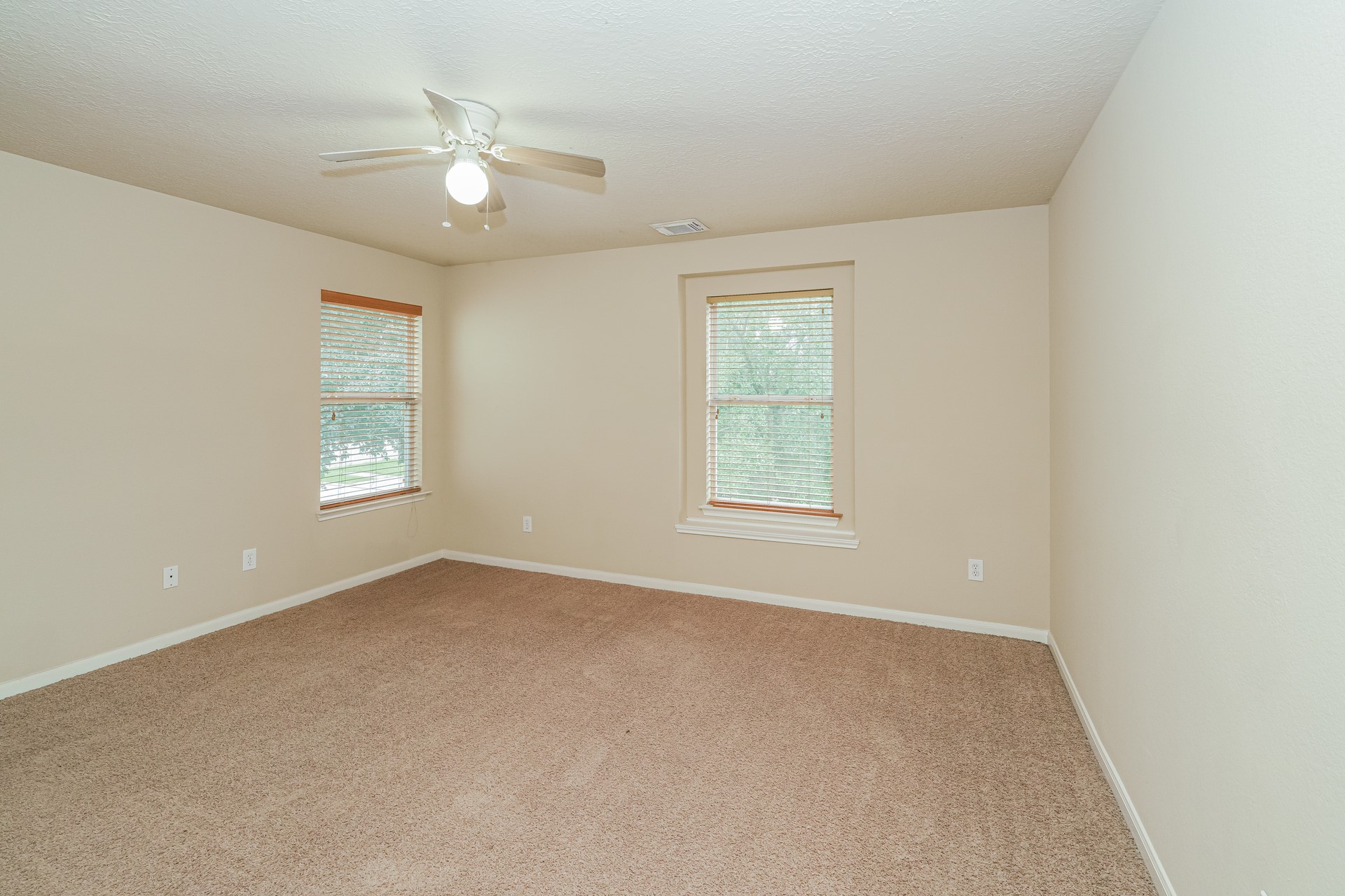 29310 Hickory Terrace Drive Spring, TX 77386 - Photo 11 of 18 an empty room with windows and ceiling fan