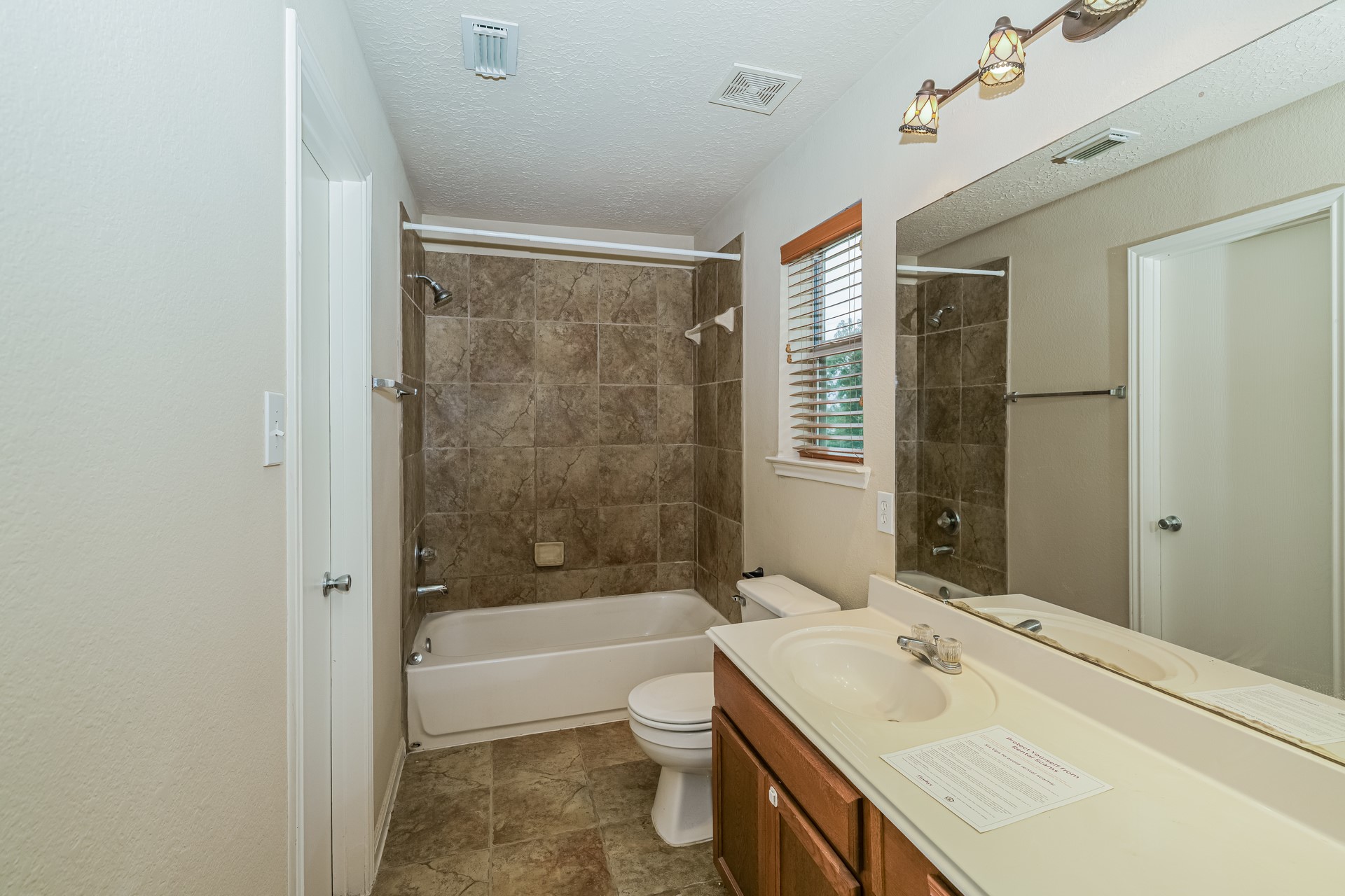 29310 Hickory Terrace Drive Spring, TX 77386 - Photo 17 of 18 a bathroom with a sink a toilet and shower