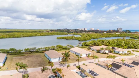 an aerial view of a golf course with parking space