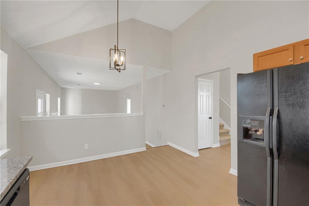 6566 Shaffers Way Lithonia, GA 30058 - Photo 12 of 31 a view of a kitchen with a sink and refrigerator